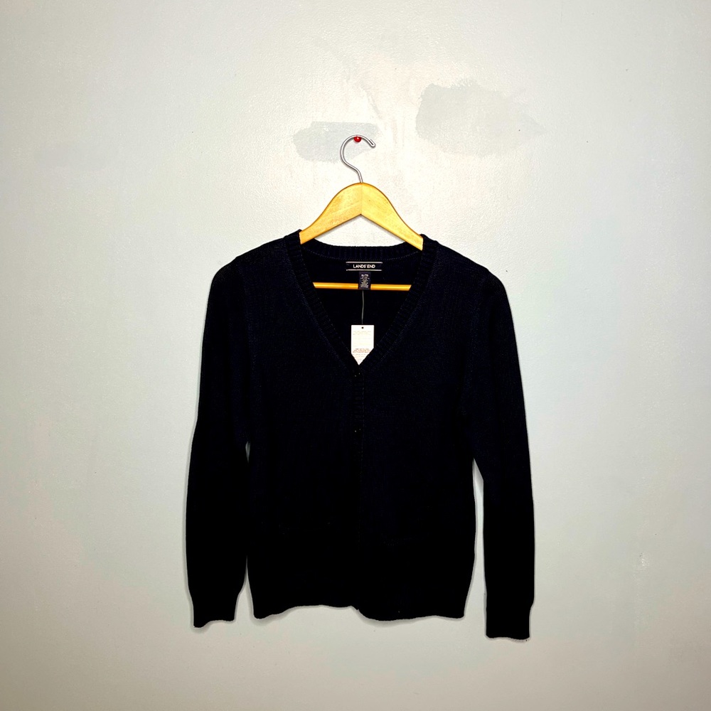 A new Land’s End button-up sweater with tags.